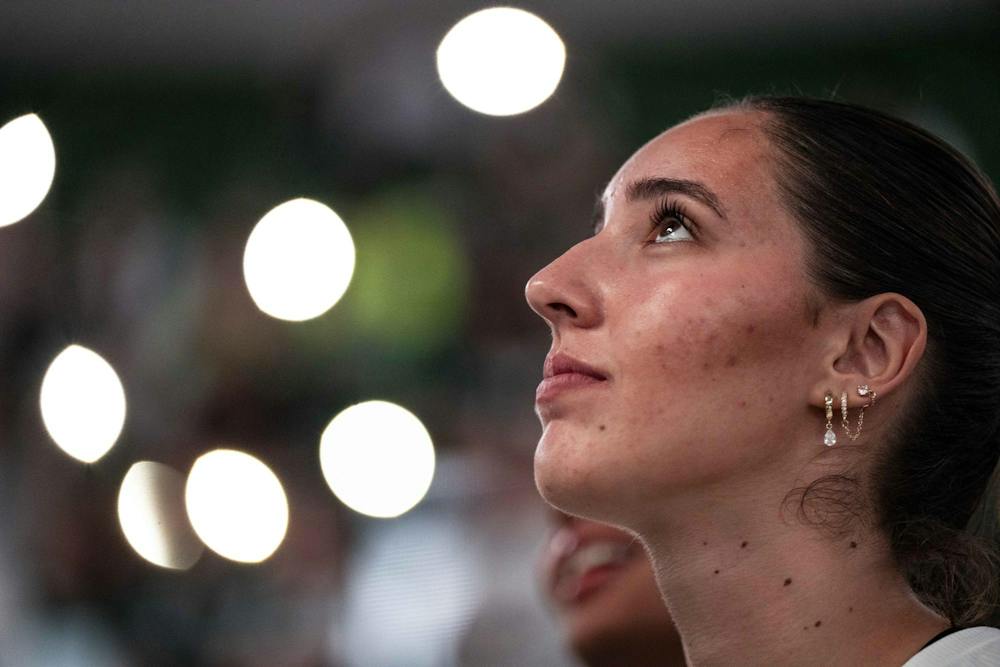 <p>Michigan State sophomore defensive specialist/libero Sarah Vellucci (13) watches the video board during starting lineup announcements before a match at the Breslin Center in East Lansing, Mich., on Friday, Sept. 25, 2026.</p>