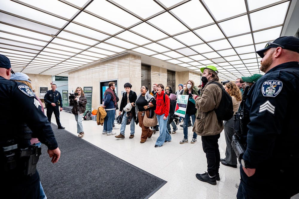 <p>Most members of the Hurriya Coalition and Michigan State Sunrise leave the lobby of the Hannah Administration Building in East Lansing, Michigan on April 11, 2025. 19 protestors were arrested after multiple trespass warnings from the police.</p>