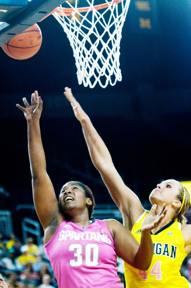 Redshirt senior forward Lykendra Johnson looks to score Sunday at Crisler Arena. Johnson added 16 points to the 65-63 MSU victory over Michigan. Jaclyn McNeal/The State News