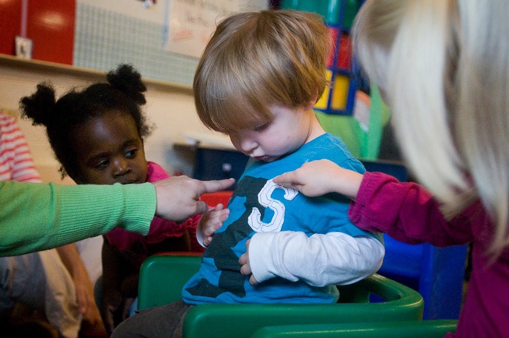	<p>Charlie Waller, 3, and his classmates take a closer look at what he&#8217;s wearing during class on Nov. 2, 2011, at Pinecrest Elementary School, 1811 Pinecrest Drive. Charlie began attending classes in a special education preschool program this fall. Matt Radick/The State News</p>