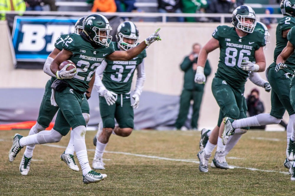 Sophomore cornerback Josiah Scott (22) runs off the field after an interception during the annual Green and White spring game on April 7, 2018 at Spartan Stadium. White defeated Green, 32-30.