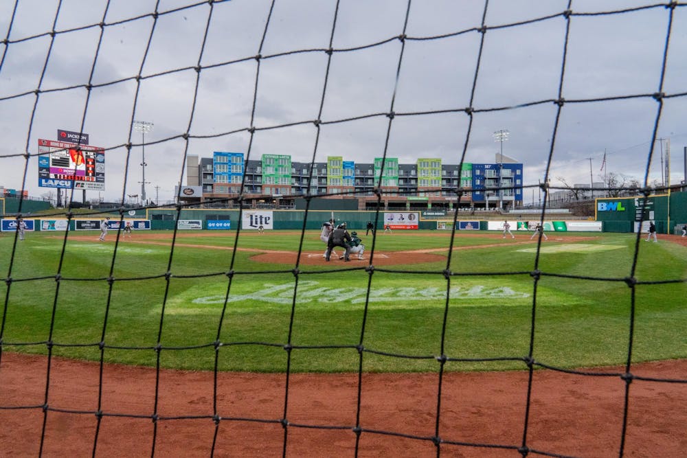 The view from behind home plate netting at Jackson Field in Lansing, MI, on Wednesday, April 3, 2024 during the "Cross Town Showdown." The soggy Wednesday evening matchup saw the Michigan State Spartans get clobbered 0-18 against the Oakland A's high-A affiliate team, the Lansing Lugnuts.