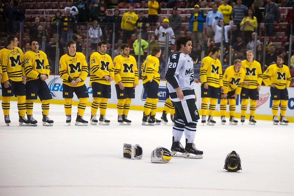 <p>Junior forward Michael Ferrantino skates past the Michigan lineup for a second place trophy Dec. 29, 2014, during the 50th Great Lakes Invitational at Joe Louis Arena in Detroit. The Spartans were defeated by the Wolverines, 2-1. Danyelle Morrow/The State News</p>