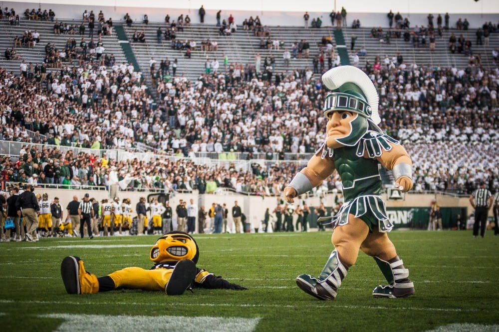 Sparty and Herky the Hawk entertain fans during the game against Iowa on Sept. 30, 2017, at Spartan Stadium. The Spartan defeated the Hawkeyes, 17-10.