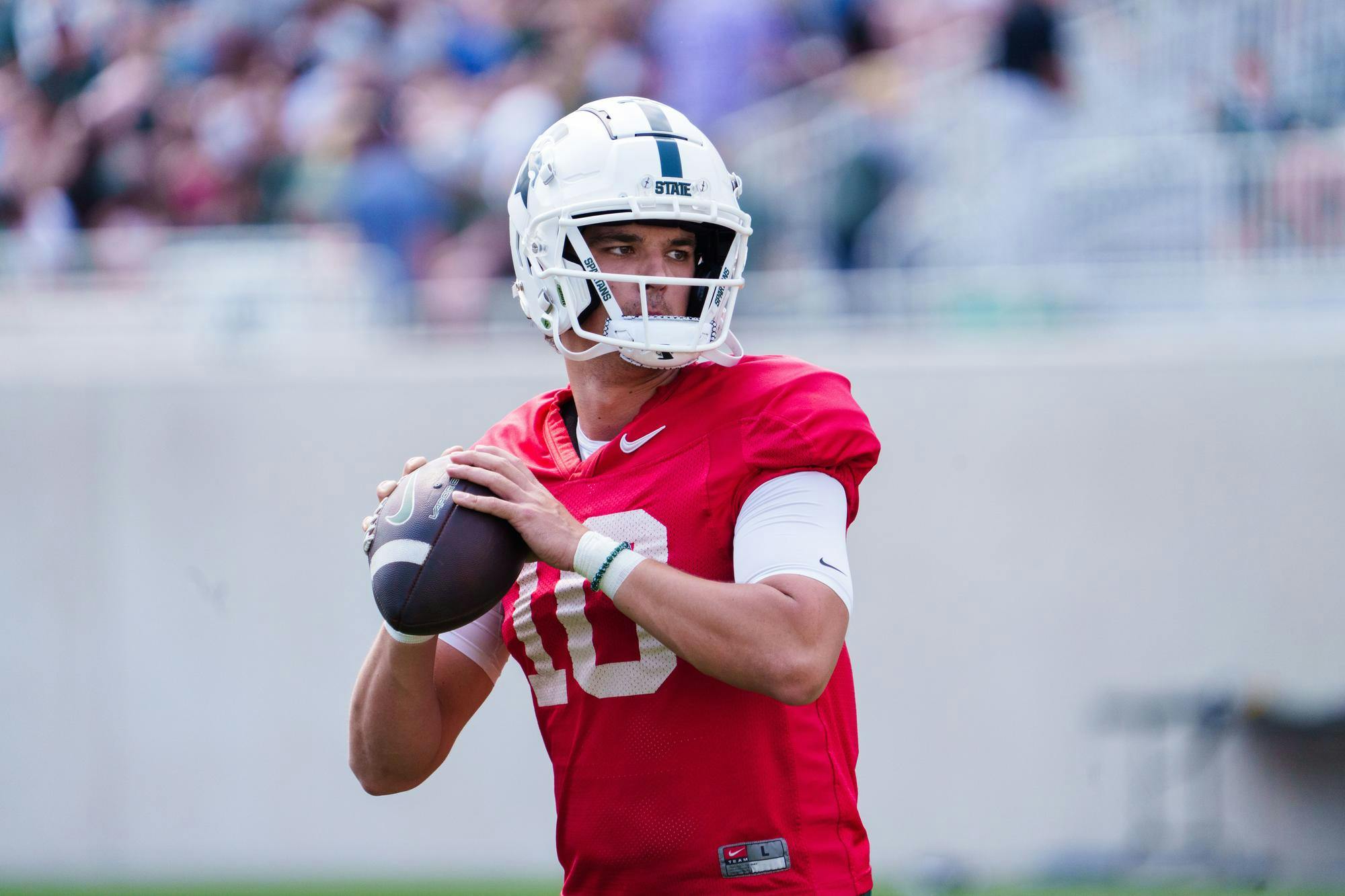 <p>Redshirt senior quarterback Payton Thorne (10) warms up before the MSU football spring open practice, held at Spartan Stadium on April 15, 2023.</p>