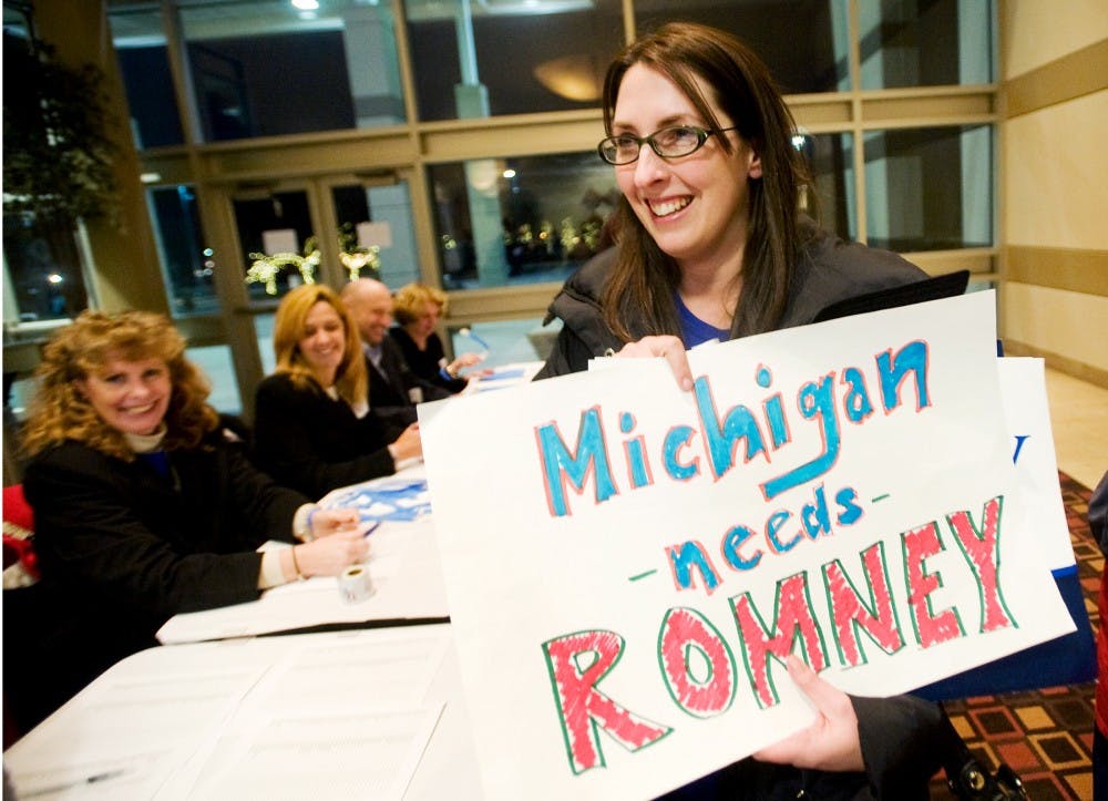 Northville Township, Mich. resident Ronna Romney-McDaniel, cousin of Republican presidential candidate Mitt Romney, checks in Tuesday night at Novi, Mich., where Romney is scheduled to deliver his speech after Tuesday's primary results are in. Justin Wan/The State News