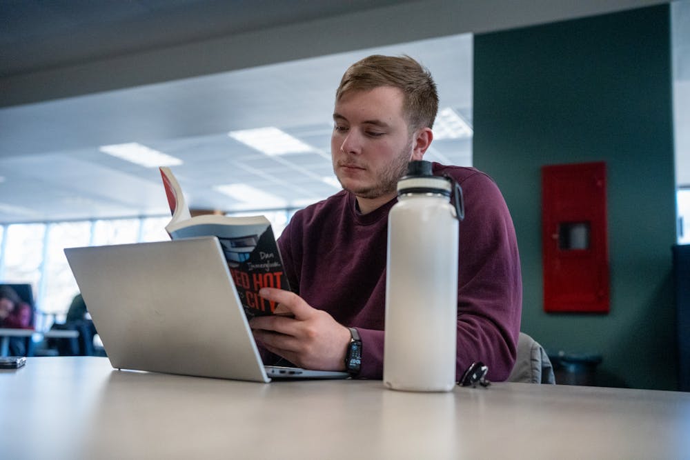 Political science pre-law senior Caleb Christensen studies in the MSU Library on March 30, 2023.