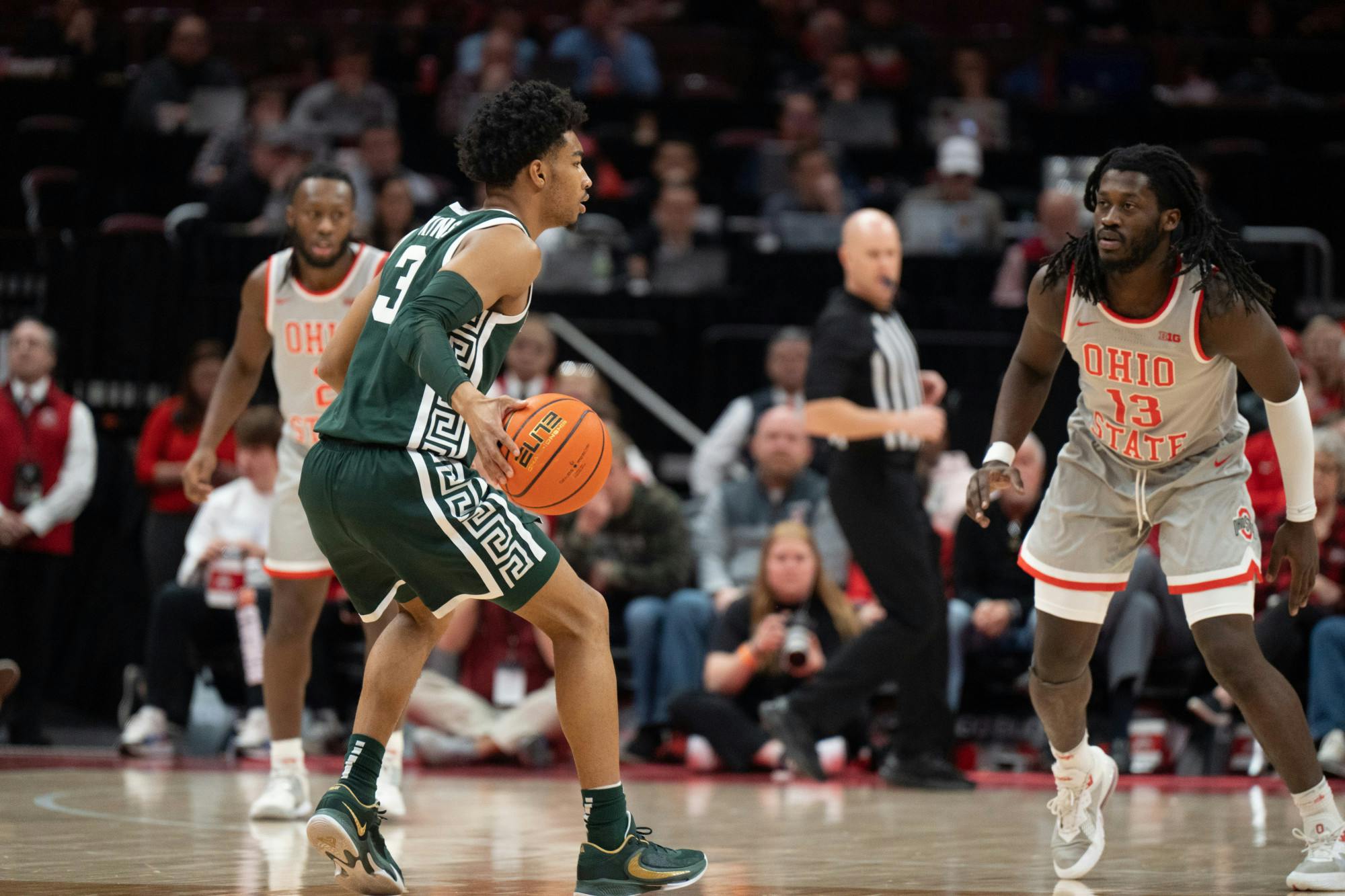 MSU guard Jaden Akins (left) carries the ball up to OSU guard Isaac Likekele at the Schottenstein Center in Columbus, Ohio on Sunday, Feb. 12, 2023. Michigan State scored 46 percent of their field goal attempts to Ohio's 28 percent.