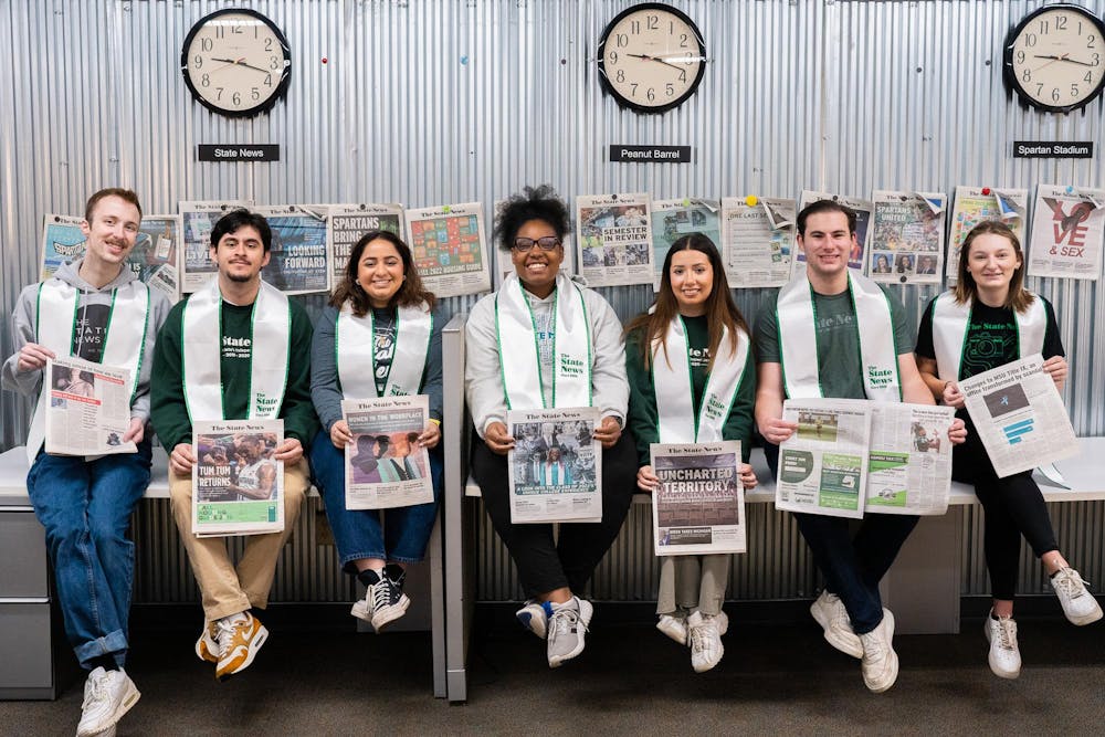 <p>Members of The State News hold the print editions that they have contributed to. These seniors have been involved with the organization for all four years of their MSU undergraduate degrees. </p>