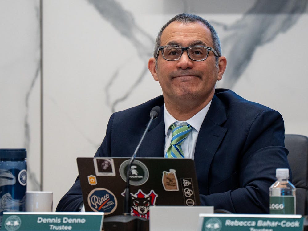 Michigan State University Trustee Dennis Denno addresses the board at Hannah Administration Building in East Lansing, Michigan on Friday, April 10, 2026.