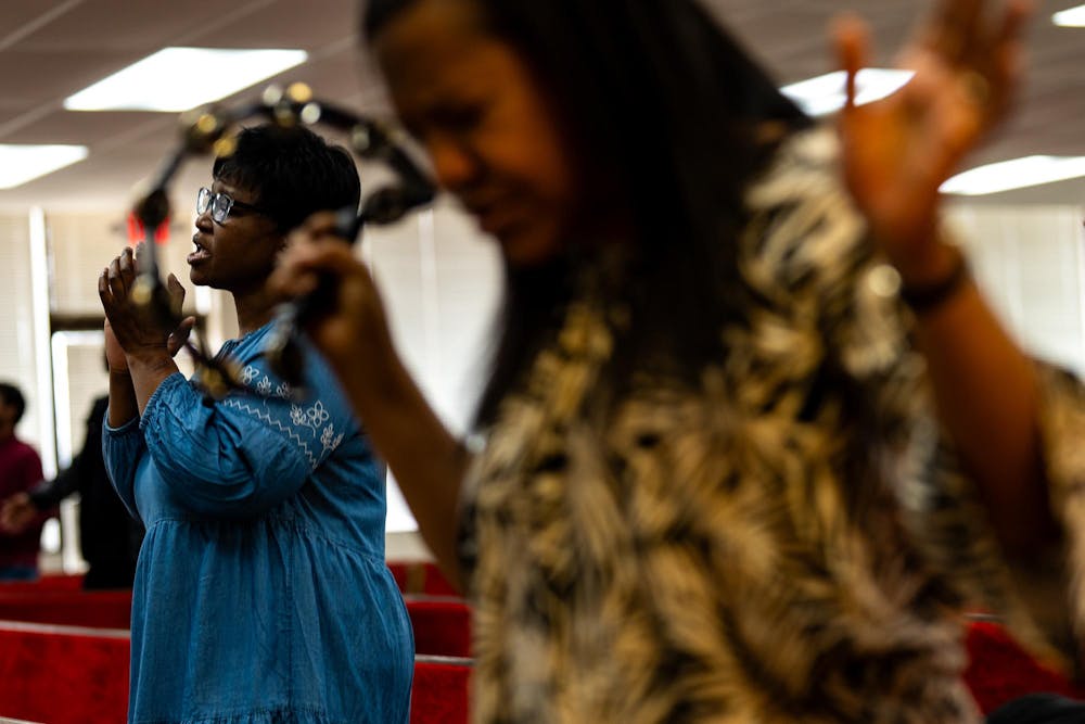 A congregation gathers for a Sunday worship service led by Pastor Michael Venyah, also known as the “Wells Preacher,” at Soulwinners Fellowship Church in Lansing, Mich., on Sunday, April 12, 2026