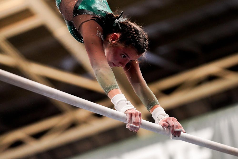 <p>All-Around sophomore Sage Kellerman warms up for bars during a match against University of Iowa at Jenison Field House on Jan. 28, 2024. The Spartans defeated the Hawkeyes with a score of 197.400-195.700.</p>