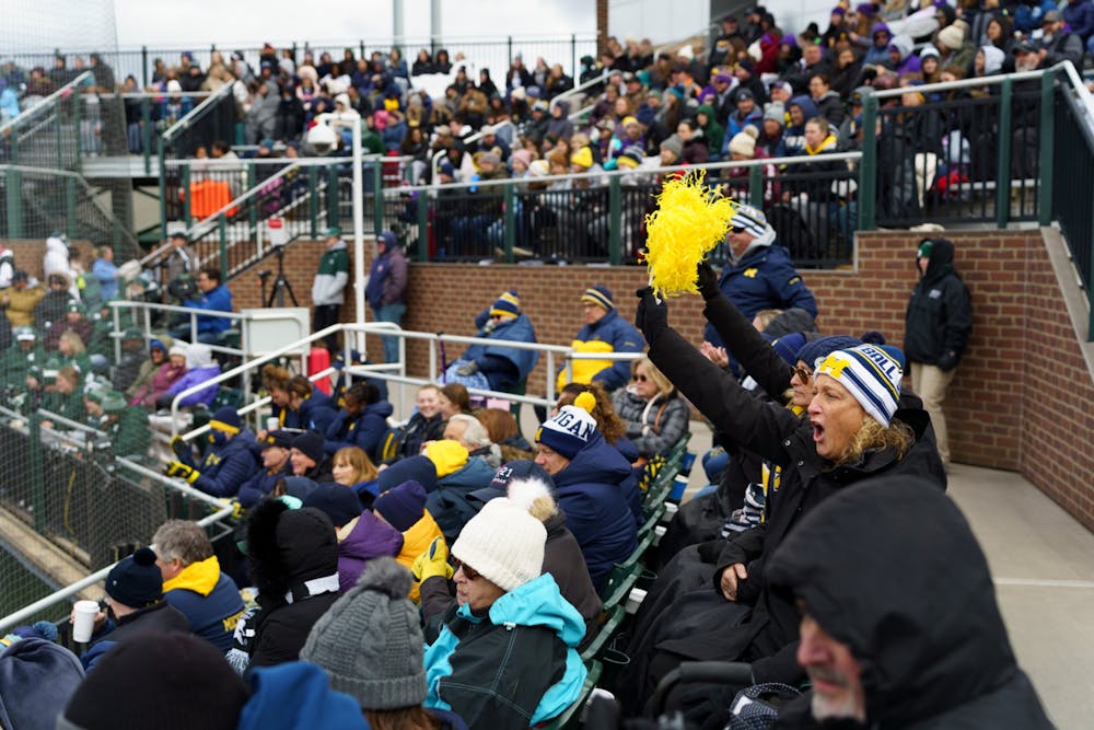 <p>Michigan fans cheering for their team as they are up to bat in the second inning. Michigan State lost 3-0 to Michigan at the Secchia Stadium, on April 19, 2022.</p>