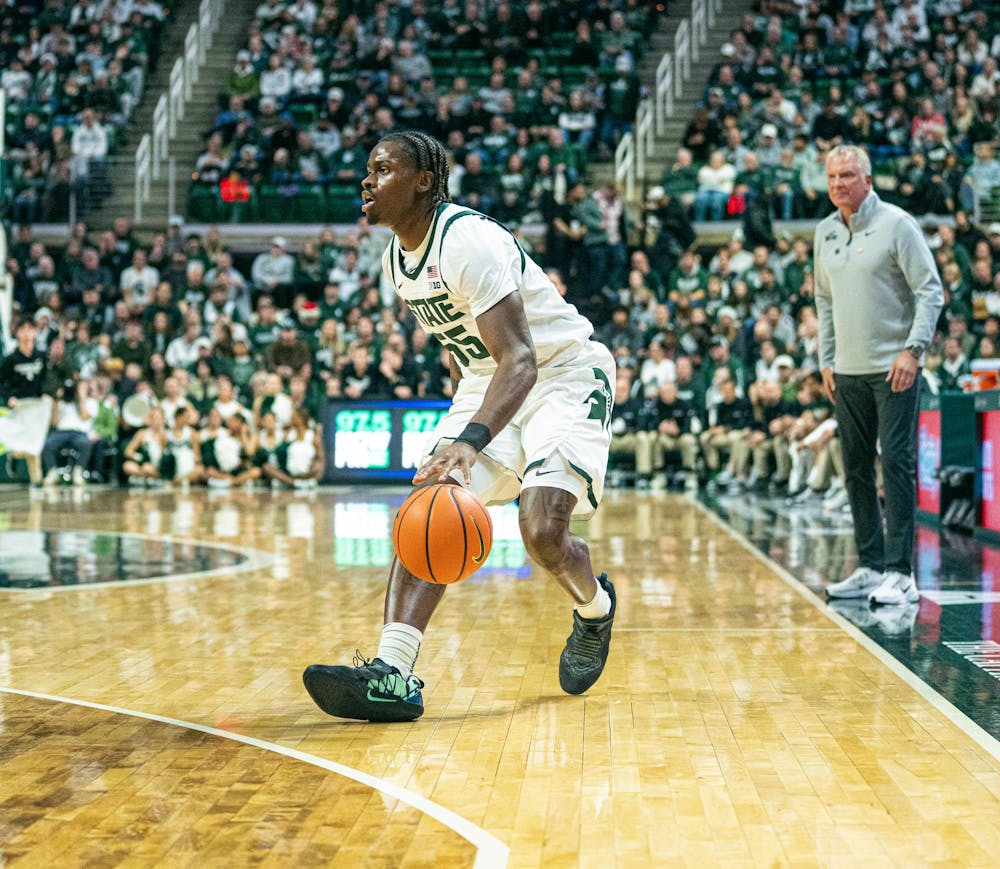 <p>MSU junior forward, Coen Carr (55) slowing himself down with the ball to try and make a shot during the game against Toledo at the Breslin Center in East Lansing, Michigan on Tuesday, Dec. 16, 2025.</p>