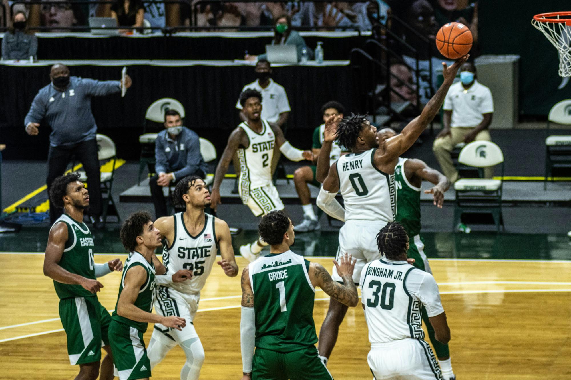 <p>Junior forward Aaron Henry (0) moves to shoot the ball during the game against Eastern Michigan on Nov. 25, 2020, at the Breslin Center. The Spartans defeated the Eagles, 83-67.</p>