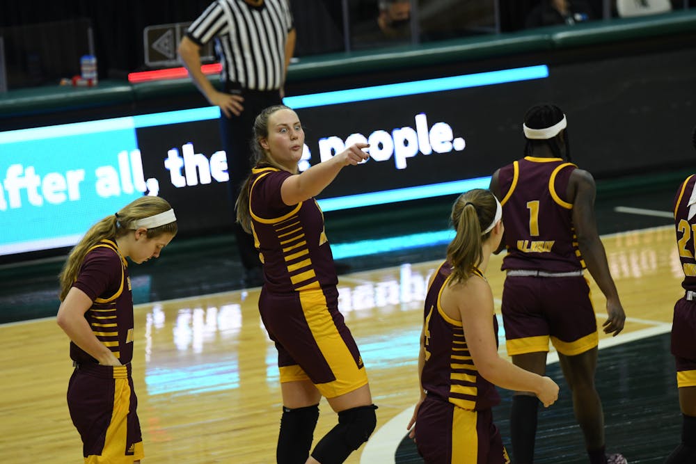 <p>Central Michigan forward Kyra Bussell jokes with teammates just before the Chippewas game vs Michigan State tips-off on Friday, Dec. 18, 2020 at the Breslin Center.</p>