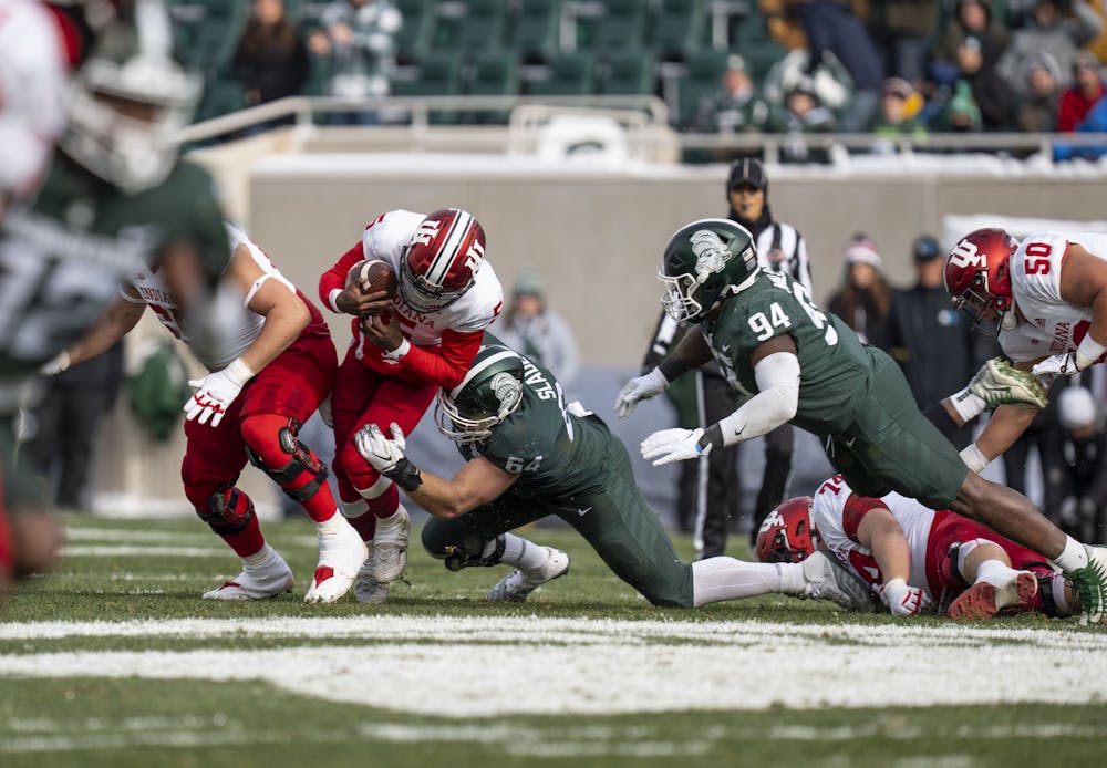 <p>Redshirt senior defensive lineman Jacob Slade, 64, stops Dexter Williams II, 5, during Michigan State’s last game at home against Indiana on Saturday, Nov. 19, 2022 at Spartan Stadium. Indiana ultimately beat the Spartans, 39-31.</p>