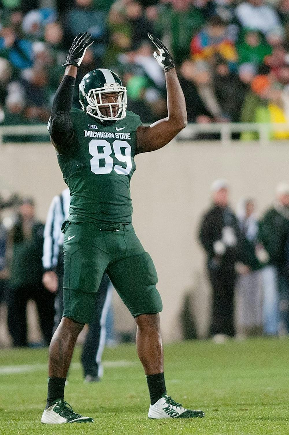 <p>Junior defensive end Shilique Calhoun raises his arms up and down to pump up the crowd during the game against Nebraska on Oct. 4, 2014, at Spartan Stadium. The Spartans defeated the Cornhuskers, 27-22. Jessalyn Tamez/The State News</p>