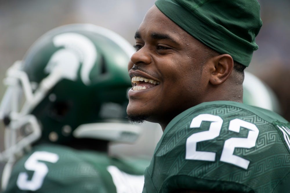 <p>Junior running back Delton Williams laughs before a game against Air Force on Sept. 19, 2015, at Spartan Stadium. The Spartans defeated the Falcons, 35-21. Julia Nagy/The State News</p>