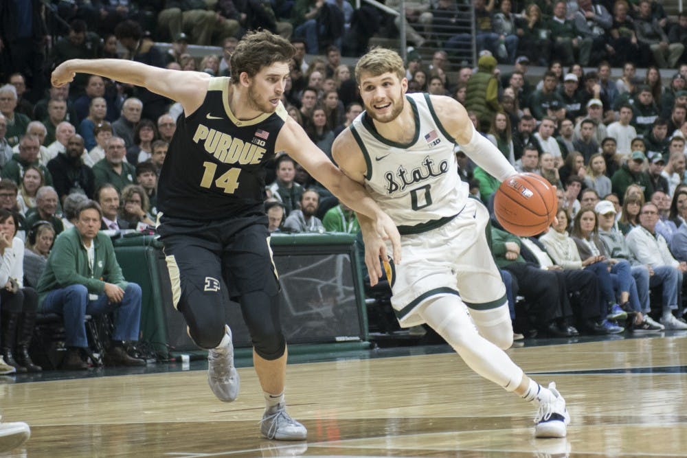 Junior guard Kyle Ahrens (0) drives to the net during the first half of the men's basketball game against Purdue on Jan. 8, 2018 at Breslin Center. The Spartans led the first half, 39-26.