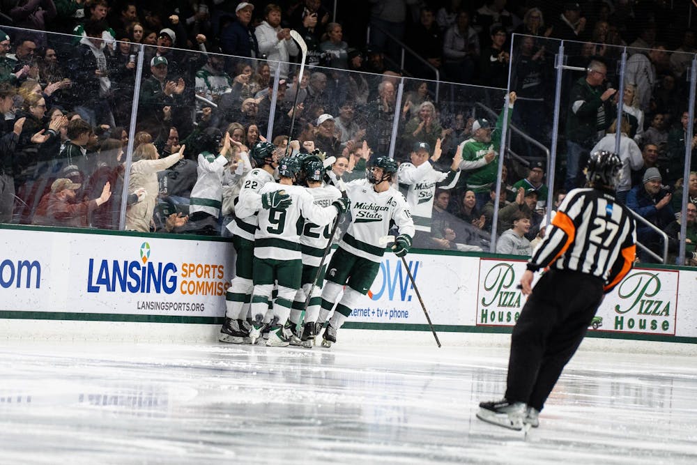 The Michigan State hockey team celebrates after scoring a point against Notre Dame at Munn Ice Arena in East Lansing, Michigan, on Friday, Feb. 20, 2026