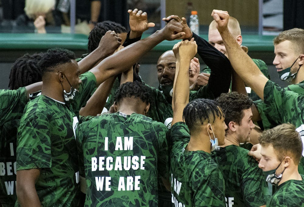 <p>Graduate student guard Joshua Langford (1) leads the team chant before their game against Notre Dame. Michigan State triumphed over Notre Dame, 80-70, on Nov. 28, 2020. </p>