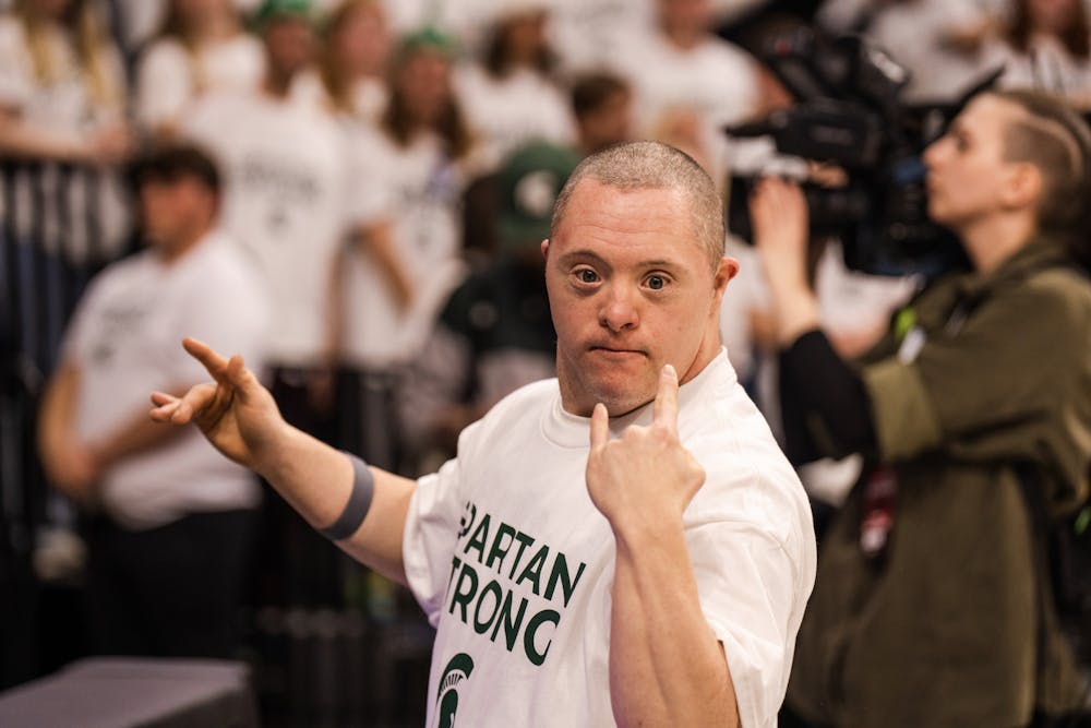 MSU Basketball superfan Barry Greer poses for a photo on Feb. 21, 2023.
