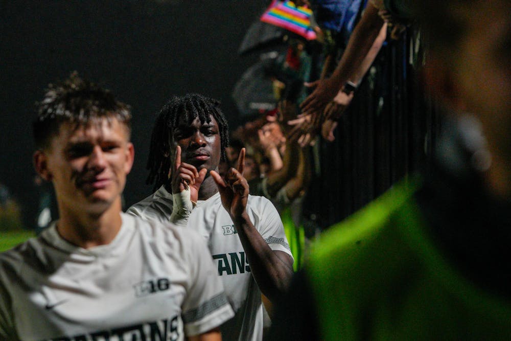 <p>Junior forward Efosa Emovon celebrates with the fans after Michigan State University's win against University of Dayton at DeMartin Soccer Complex on Sept. 7, 2023.</p>