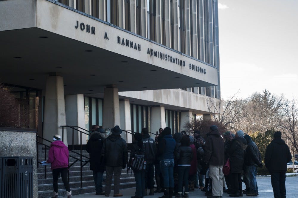 A group of protesters congregate outside of the Hannah Administration Building on March 2, 2018 for a rally lead by the David Alexander Bullock. (Annie Barker | State News)