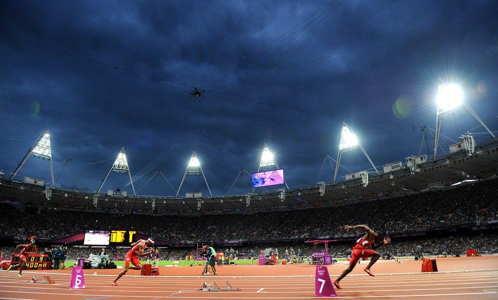 Competitors in the men&apos;s 40m hurdles take off from their blocks under a stormy sky during the Summer Olympic Games on Monday, August 6, 2012, in London, England. (Wally Skalij/Los Angeles Times/MCT)
