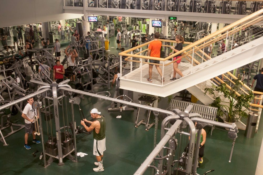 <p>Students and visitors use the gym facilities at IM Sports-West on Sept. 29, 2014.</p>