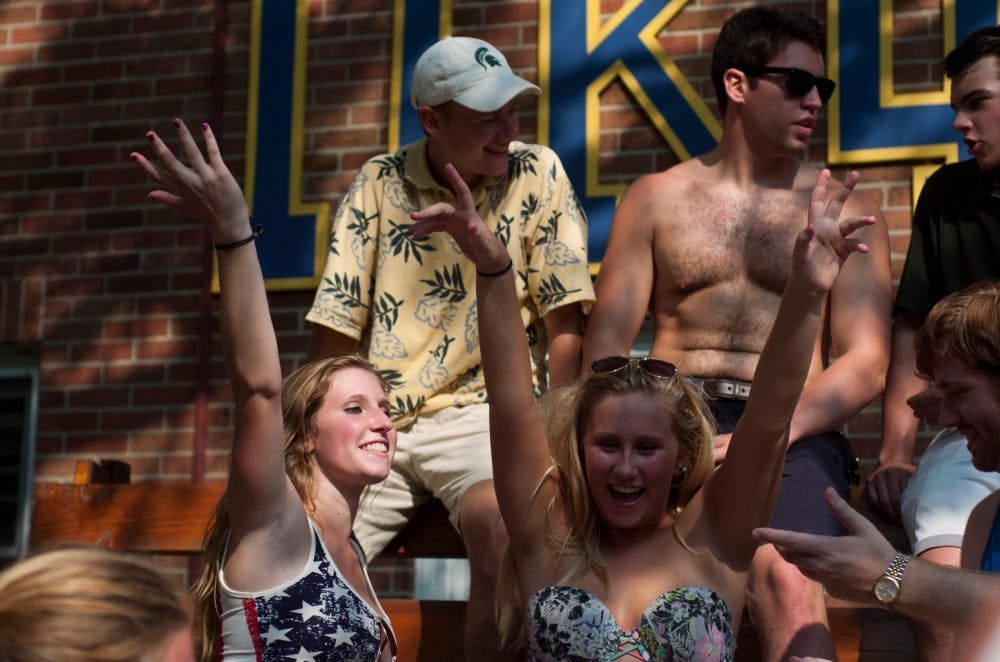 <p>Marketing sophomore Bri Minbiole, left, and marketing sophomore Chelsea Hayes party on Labor Day on Sept. 7, 2015, at Pi Kappa Phi 520 Linden in East Lansing. "Pi Kappas have made my labor day so much fun," said Hayes. Treasure Roberts/The State News</p>