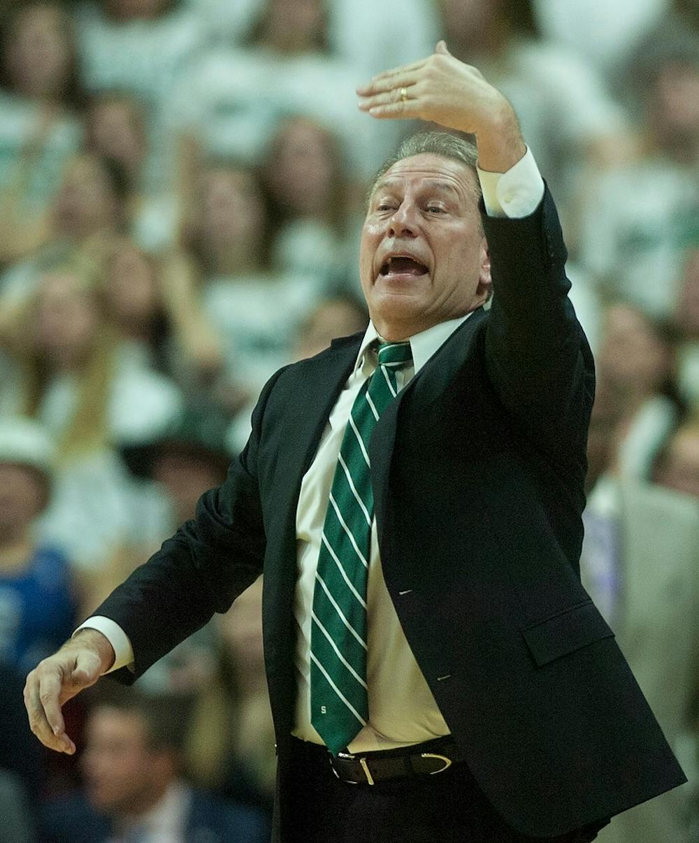 <p>Head coach Tom Izzo signals to his players while on the court Jan. 18, 2015, during the game against Michigan at Breslin Center. The Spartans defeated the Wolverines, 76-67. Erin Hampton/The State News</p>