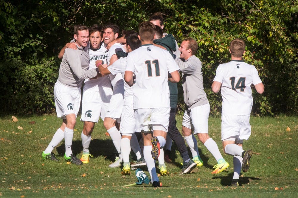 The Spartans celebrate after freshman midfielder Giuseppe Barone (10) scored a goal during the game against Northwestern on Oct. 22, 2016 at DeMartin Stadium at Old College Field. The Spartans defeated the Wildcats, 2-1.