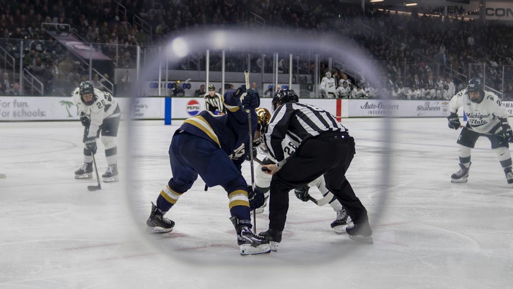 <p>MSU and Notre Dame players take their positions for a face-off at Munn Ice Arena on Nov. 15, 2024. Michigan State took the win 8-3.</p>