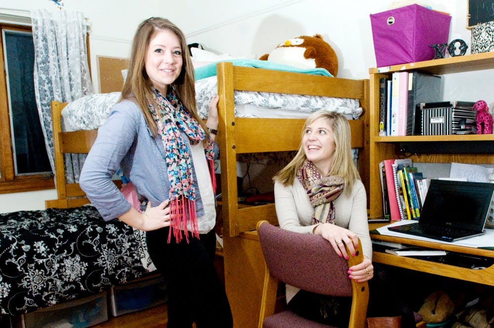 Sorority sisters advertising sophomore Emily Jaslove, left, and marketing junior Amanda Stowers both live at the Chi Omega sorority house because they wanted a more intimate living setting. "I like that there are people around all the time. In the dorms there are a lot of people you don't know, but here I live with 47 of my best friends," Jaslove said. Derek Berggren/The State News