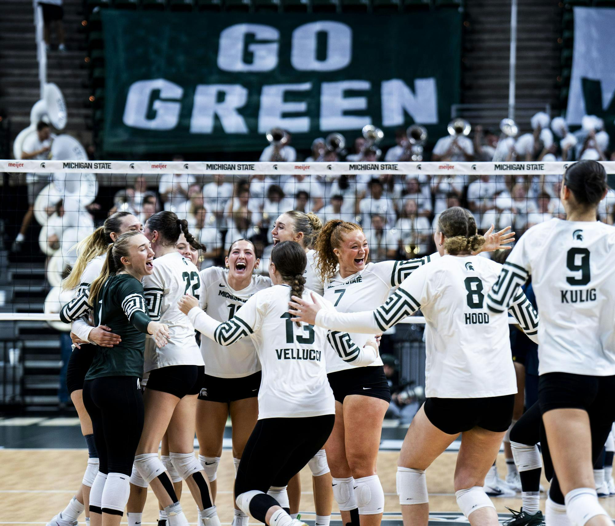Michigan State volleyball players celebrate after scoring the winning point against the University of Michigan at the Breslin Center on Sept. 27, 2025. MSU defeated UMich 3-0. 