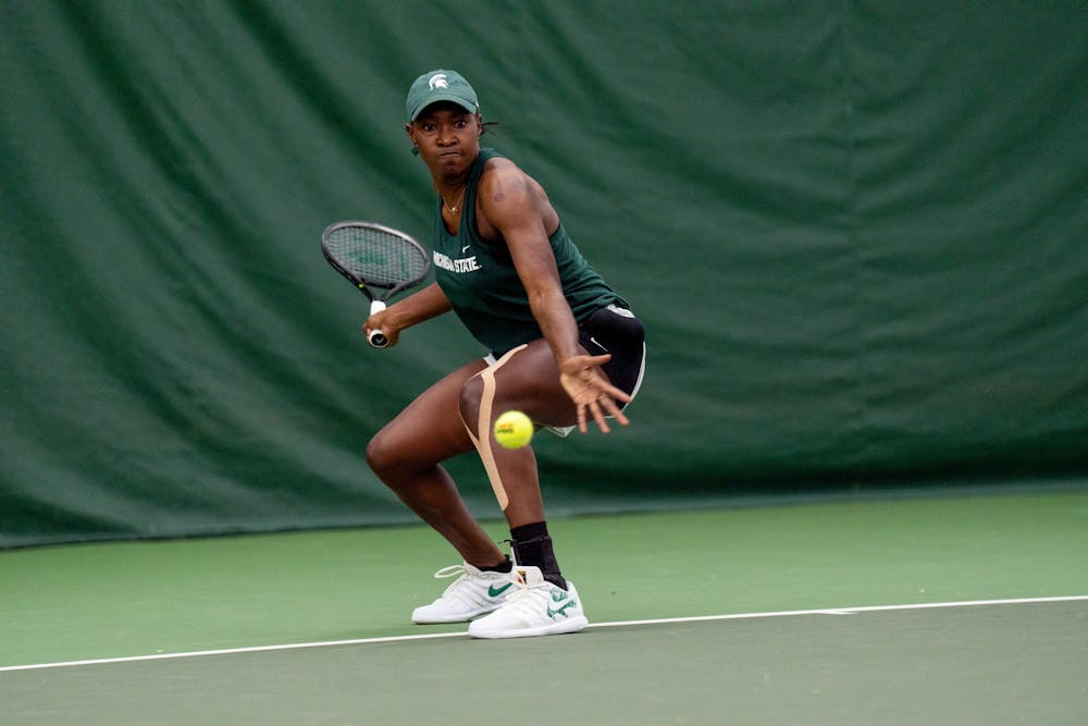 <p>Sophomore Mary Lewis prepares for the incoming ball in her singles match. Lewis would lose the match, 7-5 6-4, to Eastern Michigan senior Luisa Pelayo. Shot Feb. 18, 2022.</p>