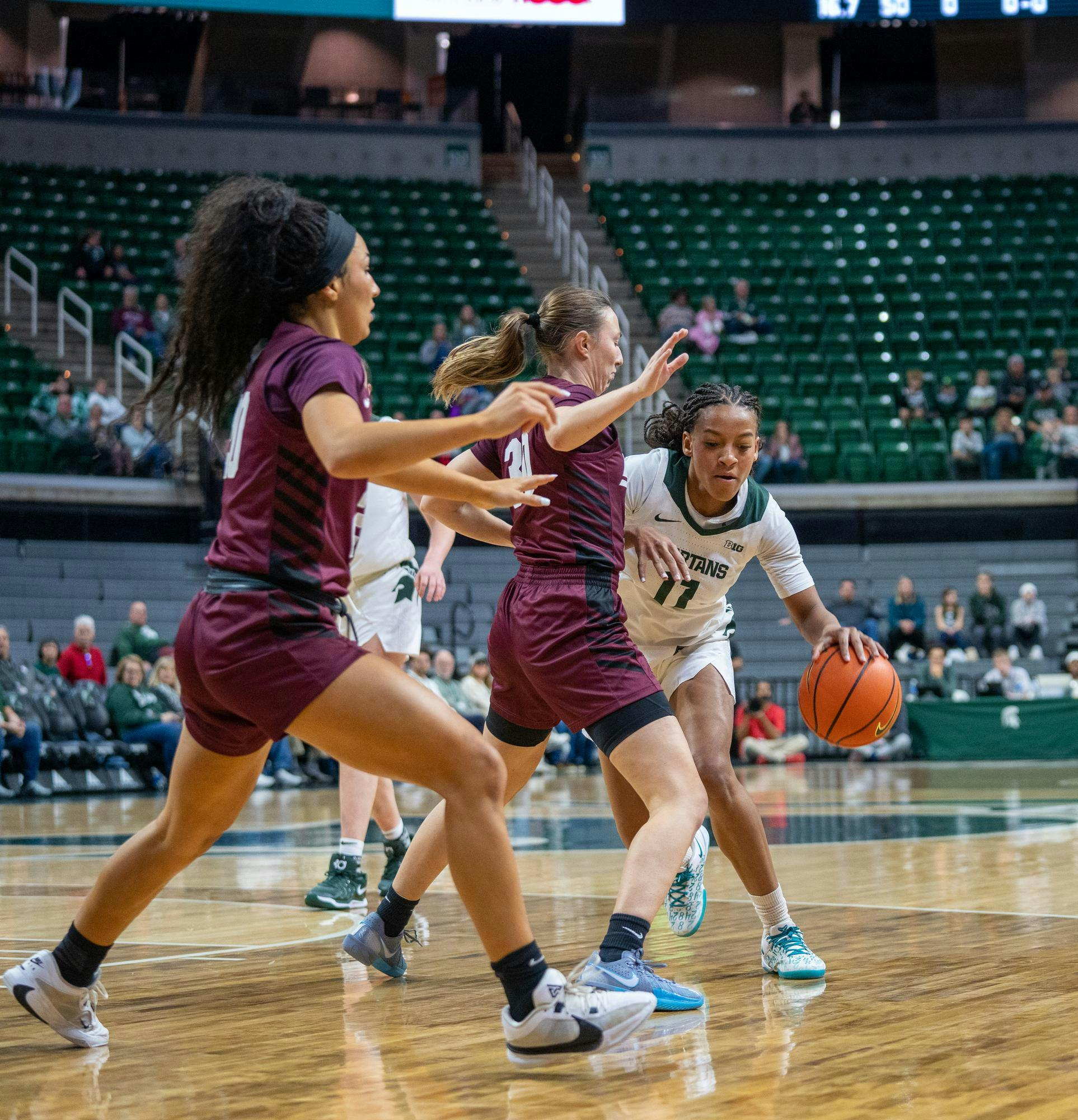 MSU Senior guard Jocelyn Tate (11) drives to the basket during a timeout as they play against Eastern Kentucky at the Breslin Center on Nov. 14, 2024.