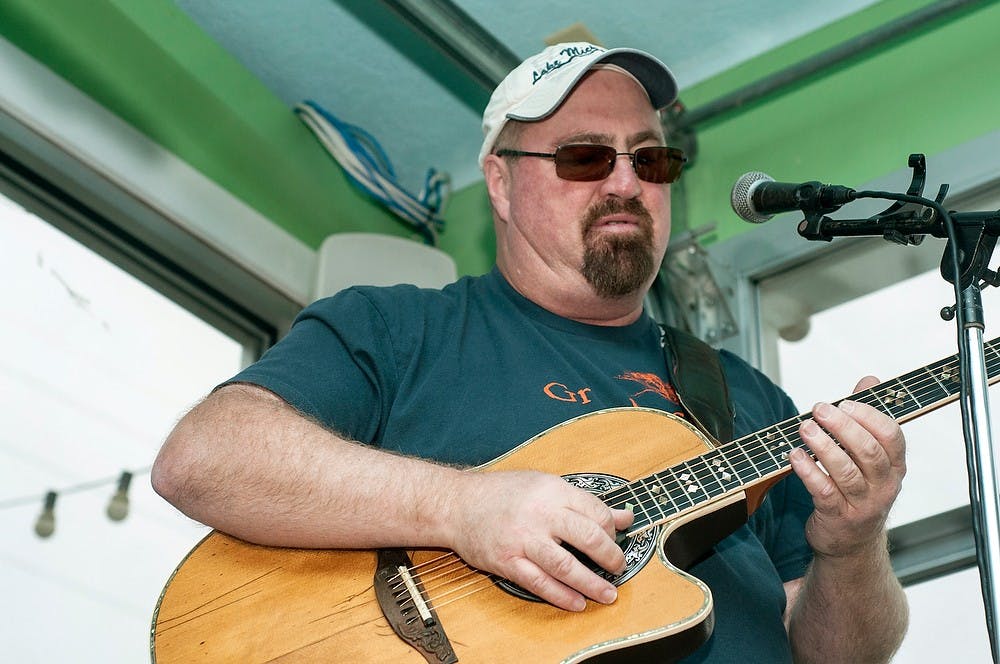 	<p>Artist Don Middlebrook performs for the crowd during his CD release party Oct. 16, 2013, at Reno&#8217;s Sports Bar and Grill, 1310 Abbot road. Middlebrook, a tropical rock musician and <span class="caps">MSU</span> alumnus, previously has toured with and opened for various artists.</p>