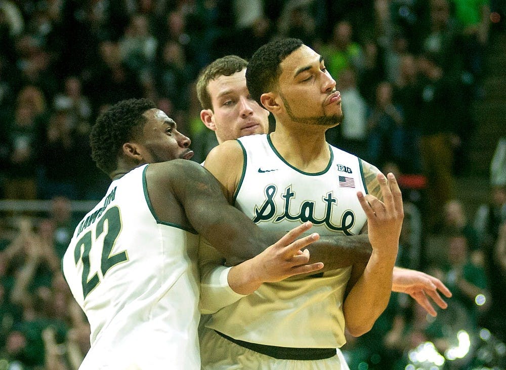 <p>Junior guard Denzel Valentine celebrates his game winning 3-pointer Feb. 14, 2015, during the game against Ohio State at Breslin Center. The Spartans defeated the Buckeyes, 59-56. Erin Hampton/The State News</p>