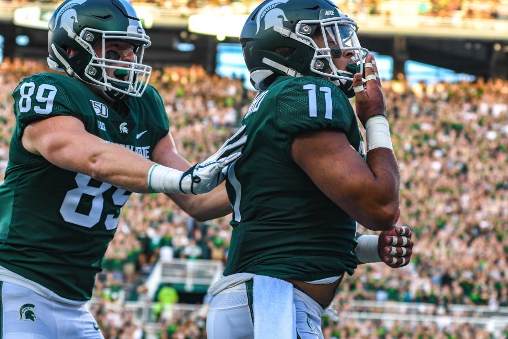 <p>Junior running back Connor Heyward (11) blows a kiss during the game against Tulsa on Aug. 30, 2019 at Spartan Stadium. The Spartans defeated the Golden Hurricane, 28-7.</p>