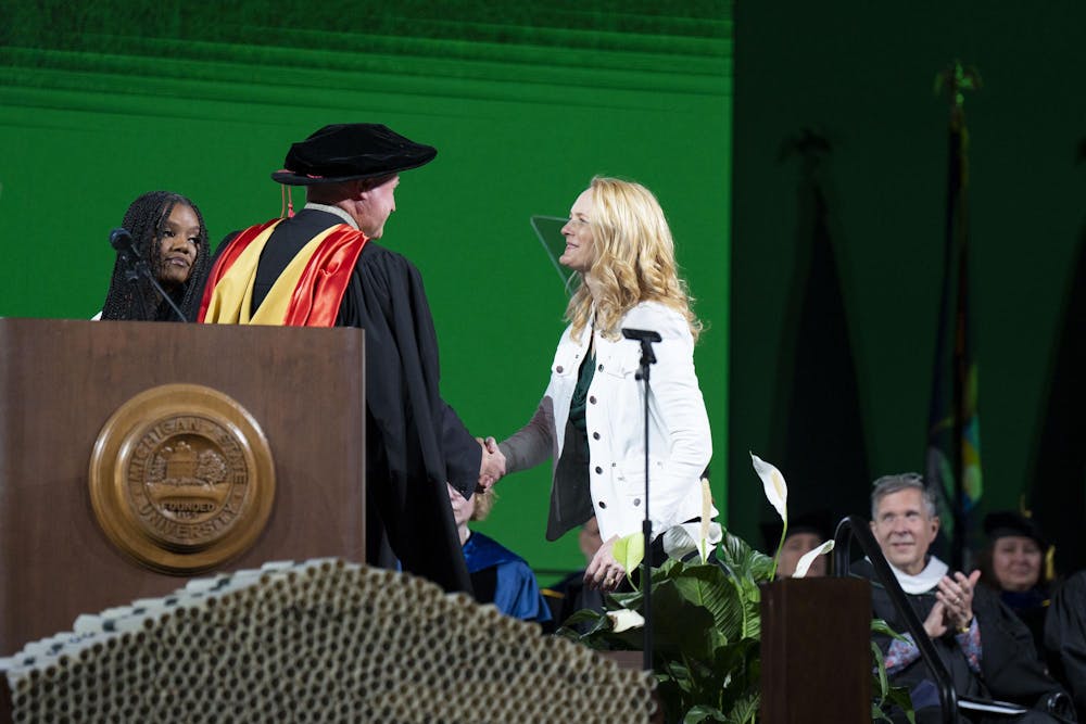 Alexandria Verner’s mom accepts her posthumous degree at The College of Natural Science graduate ceremony alongside Arielle Anderson’s sister on Saturday, May 6, 2023 at the Breslin Center.