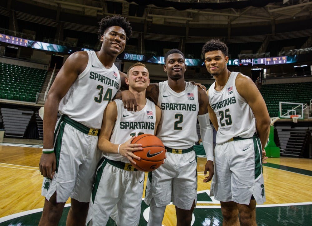 <p>Freshman forward Julius Marble (34), freshman guard Steven Izzo (13), freshman guard Rocket Watts (2) and freshman forward Malik Hall (25) during MSU basketball media day on Oct. 15, 2019 at the Breslin Center.</p>