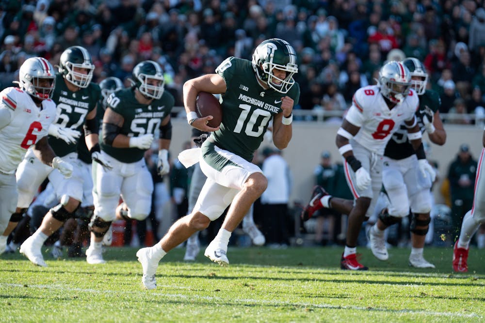 <p>Redshirt junior quarterback Payton Thorne, 10, rushes the ball during the game against the Buckeyes on Oct. 8, 2022.﻿</p>