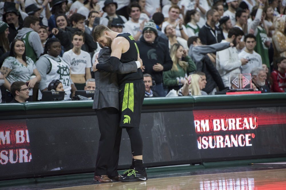 <p>Junior guard Kyle Ahrens (0) embraces Michigan State head coach Tom Izzo during the men&#x27;s basketball game against Ohio State on Feb. 17, 2019 at Breslin Center. The Spartans defeated the Buckeyes, 62-44. Nic Antaya/The State News</p>