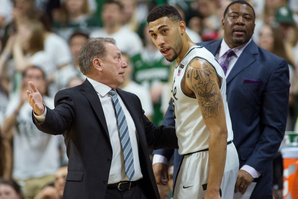 Head coach Tom Izzo talks to senior guard Denzel Valentine during the game against Florida on Dec. 12, 2015 at Breslin Center. The Spartans defeated the Gators, 58-52.