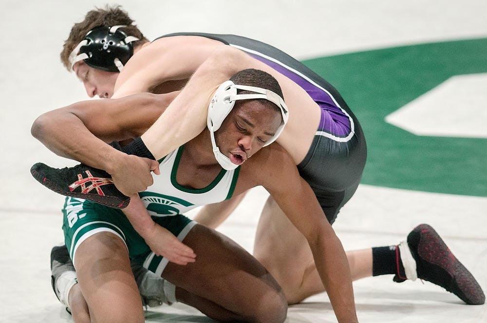 	<p>Sophomore 157-pounder Ryan Watts wrestles Northwestern Jason Welch on Jan. 25, 2013, at Jenison Field House. Welch won 5-1 but the team went on to lose 18-15.. Natalie Kolb/The State News</p>
