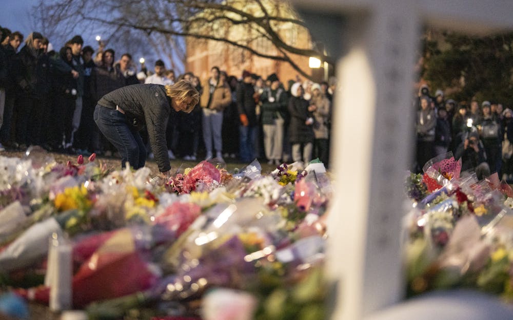<p>Thousands gathered at the Rock on Farm Lane on Wednesday, Feb. 15, 2023 to remember Brian Fraser, Alexandria Verner and Arielle Anderson, the three victims of Michigan State University’s mass shooting on Feb. 13.</p>