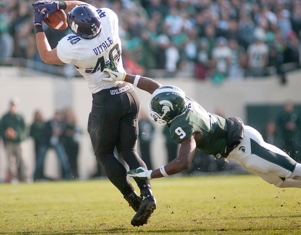 	<p>Slotback Dan Vitale escapes junior safety Isaiah Lewis for a reception on Saturday, Nov. 17, 2012, at Spartan Stadium. The Spartan&#8217;s fell to the Northwestern Wildcats 23-20. James Ristau/The State News</p>